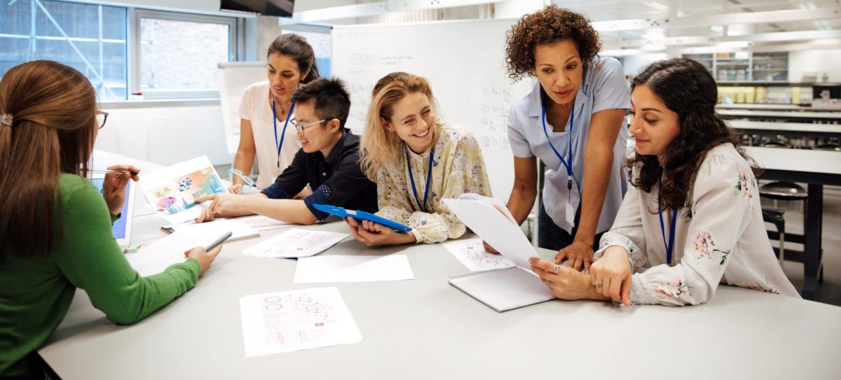 Lab and support staff hold a meeting